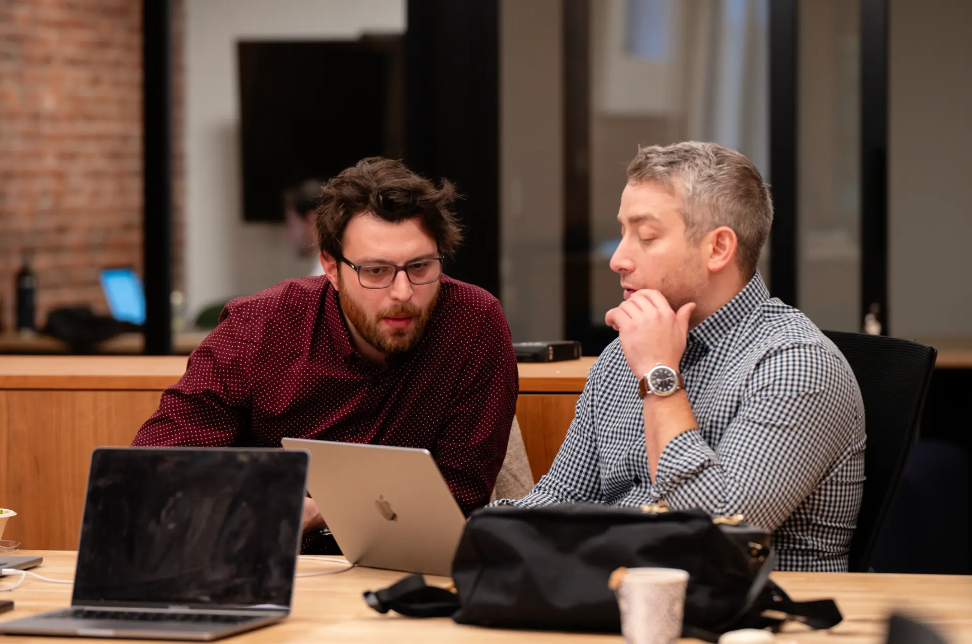 Two Skydog team members pairing on a client build