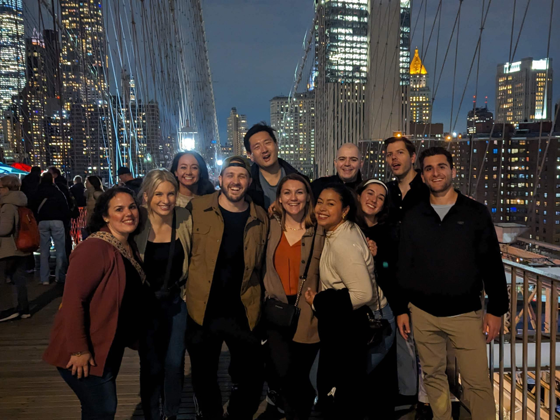 Skydog team on the Brooklyn Bridge at night during a team summit